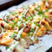 Recette de quartiers de pommes de terre au bacon gratinés